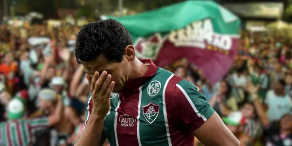 Ao fundo, torcida do Flumeinse, em primeiro plano, Paulo Henrique decepcionado