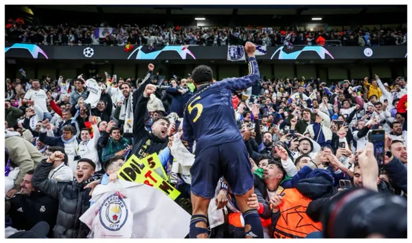 Beellingham comemorando a classificação com a torcida do Real Madrid