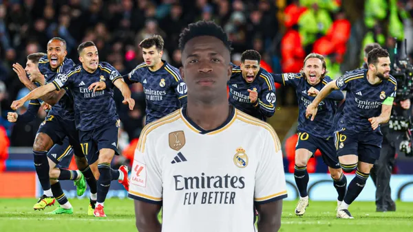 Vini Jr com a camisa do Real Madrid com os jogadores comemorando a classificação a fundo