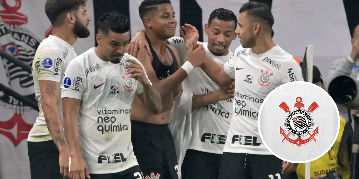 Equipe do Corinthians e ao lado o escudo do clube